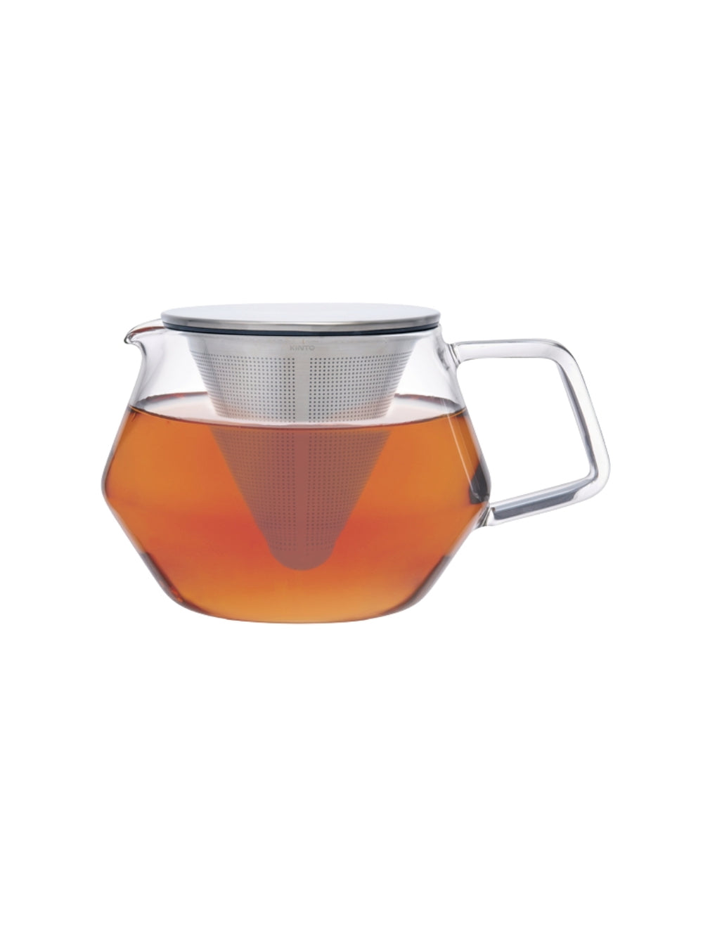 Clear glass teapot with metal infuser filled with tea on a white background